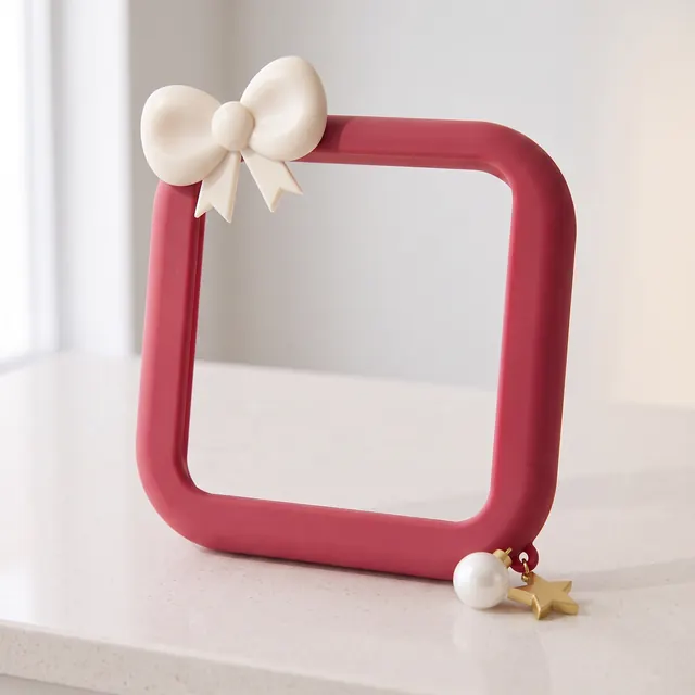Holly Bow frame with an ivory bow on a white counter